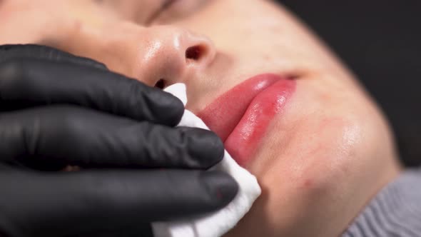 Healthy Spa Young Beautiful Woman Having Permanent Makeup on Her Lips