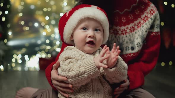 Baby Claps His Hands Joyfully at Xmas