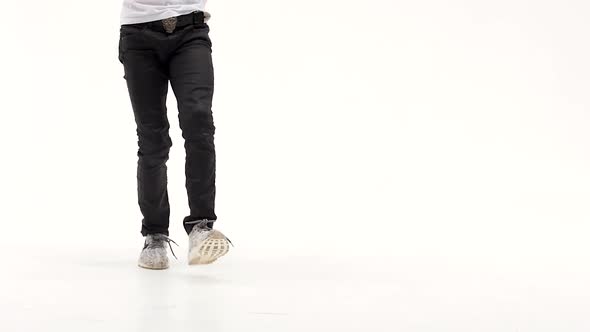 Little Boy Is Dancing a Modern Dance on the White Background in Black Leather Jackets and Jeans