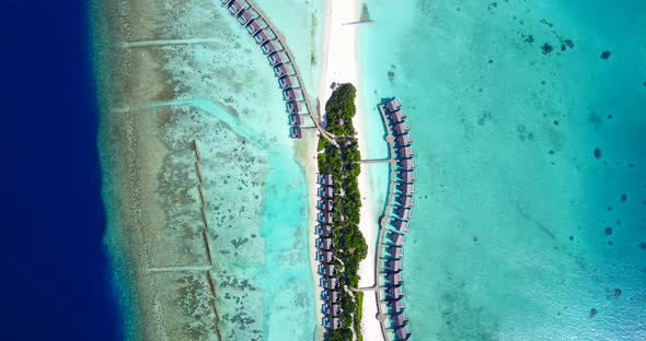 Natural drone island view of a paradise sunny white sand beach and blue ocean background in 4K