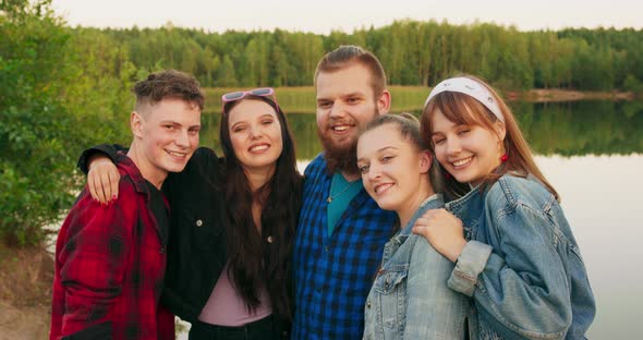 Teens Multiethnic Friends Having Fun Near Lake Looking at Camera Enjoying Their Time
