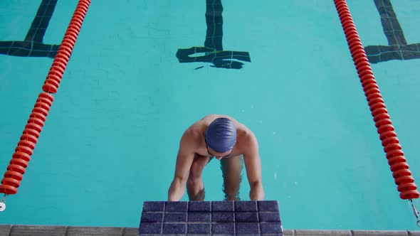 Swimmer diving into the pool
