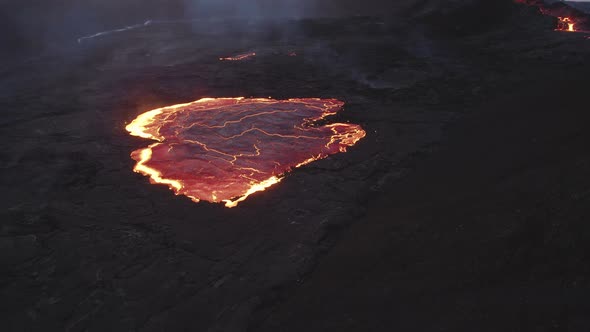 Drone Over Pool Of Molten Lava From Erupting Fagradalsfjall Volcano