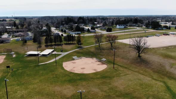 Aerial shot of a baseball field right next to a neighborhood