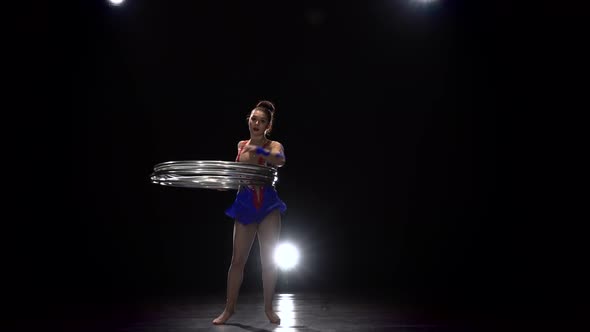 Professional Gymnast Twists the Hoops on Her Body