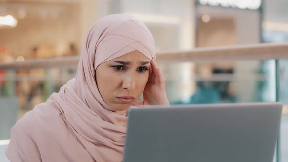 Young Upset Arab Woman Receiving Email Reads Bad News on Laptop Letter with Refusal Health Problems