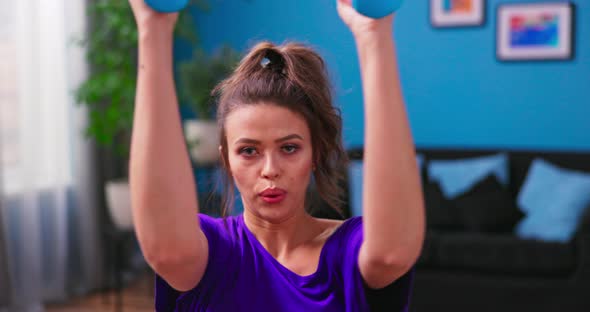 Cropped Image of Determined Woman Losing Weight at Home and Exercising with Dumbbells