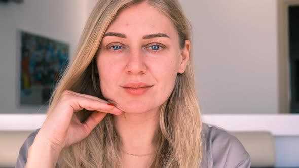 Woman Does Facial Gymnastics Exercises