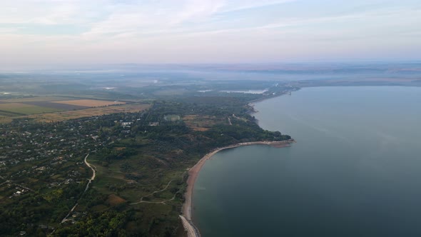 Aerial drone view of the Duruitoarea natural reservation in Moldova. River and fog in the air, hills