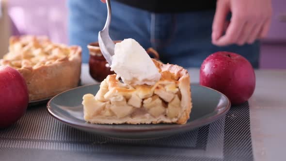 Apple Pice Cake Preparation Series  Woman Puts a Spoon of Ice Cream on Top of Piece of Cake