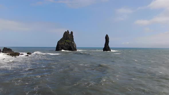 Aerial view of Reynisdrangar basalt sea stacks near Reynisfjara beach, Iceland