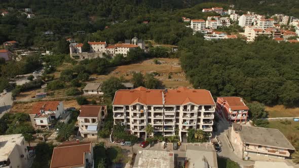 Podmaine Monastery Next to the Buildings of the Town of Budva