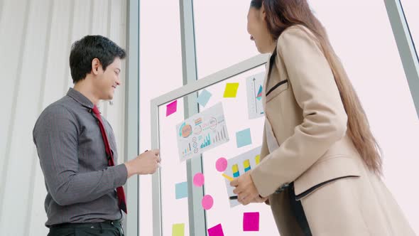 Business People Work on Project Planning Board