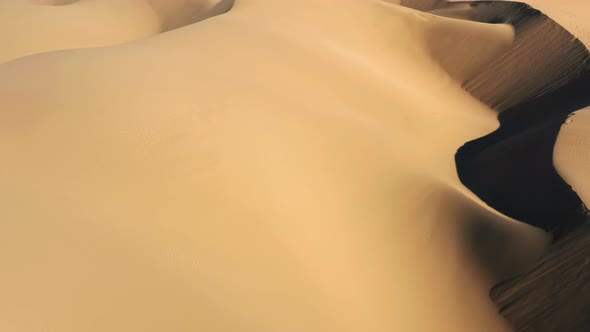  Aerial Drone View Flying By Beautiful Wavy Sand Dunes in Golden Sunset Light