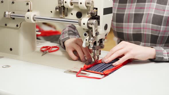 Woman Working on Sewing Machine While Making Mask