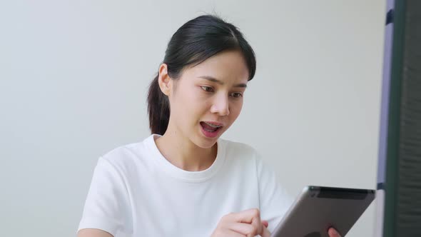 Woman in a white t-shirt and look talk to camera at video calling recording