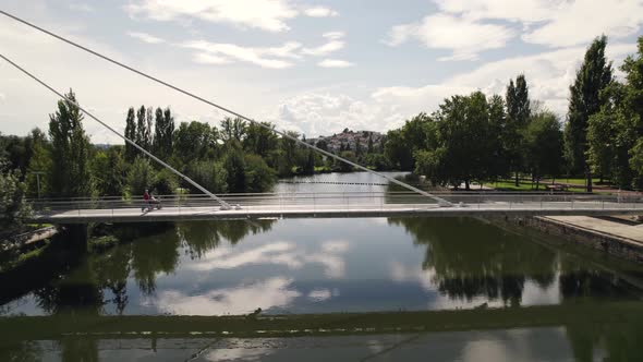 People walk cable-stayed Bridge of the Tâmega River, Chaves, Portugal