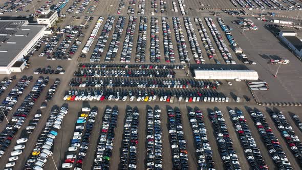 Aerial of a Automotive Car Terminal Parking Lot Storage Loading Area Ready for Distribution in the