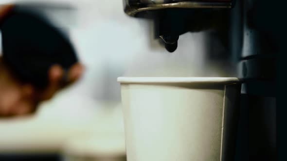 Bartender Preparing Coffee Using Coffee Machine