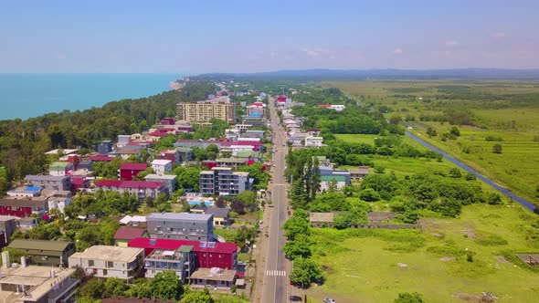 Drone view of town of Kobuleti on Black Sea coast on sunny spring day, Georgia