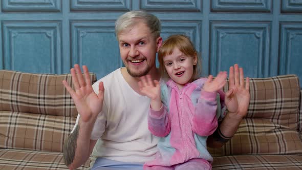 Father and Little Child Daughter Kid Smiling Joyfully Greeting Waving Hi Hello Welcome Together