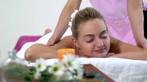 Woman Gets Back Massage Spa By Massage Therapist