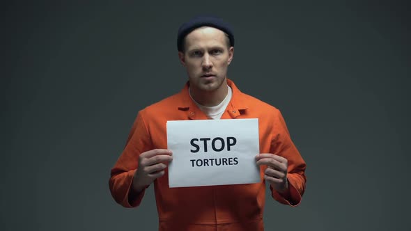 European Prisoner Holding Stop Tortures Sign, Physical Abuse in Cell, Harassment
