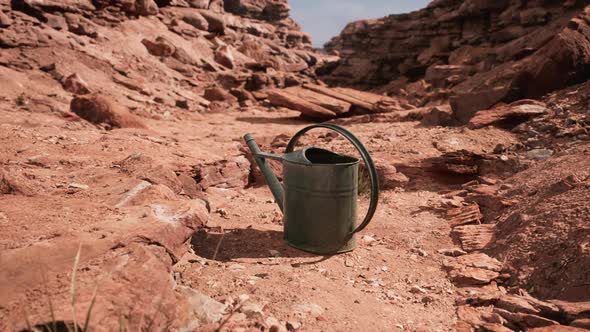 Beverage Can in Sand and Rocks Desert