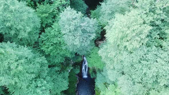 Aerial top view of Waterfall Azhek in forest of Sochi, Russia