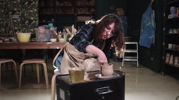 Pottery Crafting in the Studio  Woman Forming a Simple Pot