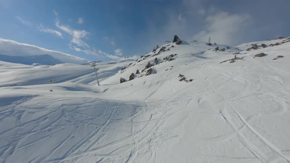 Picturesque Mountain Landscape of Ski Resort with High Mountain Downhill Snowy Peaks and Cableway