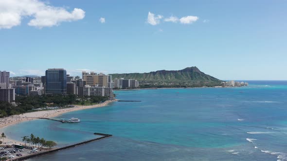 Super wide aerial shot of Waikiki with the Diamond Head monument in the background on the island of