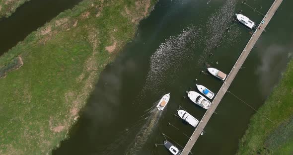 Aerial view of luxury floating ship boat at blue ocean at the high altitude view