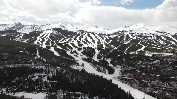 4k drone video of Rocky Mountains in winter with ski slopes in Breckenridge, Colorado.