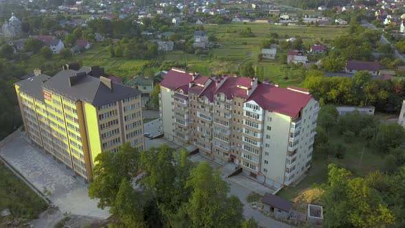 Aerial View of Multistory Apartment Building in Green Residential Area