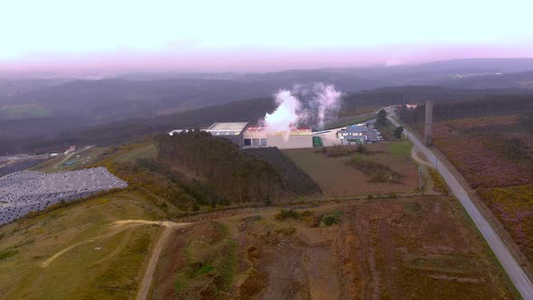 Aerial View Of Smoke Steam Rising From Sogama Waste Treatment Plant. Dolly Back