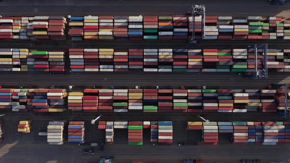 Aerial Vertical Shot Of Colorful Intermodal Shipping Containers In An Industrial Port. - Overhead Sh