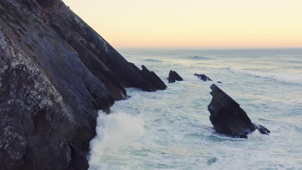 Aerial Drone View of Portugal Atlantic Coast at Lisbon, a Dramatic Rugged Rocky Coastline with Waves
