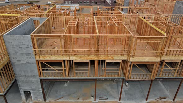 Wooden Beam Framing on Urban Apartment Complex Construction with Wooden Framework