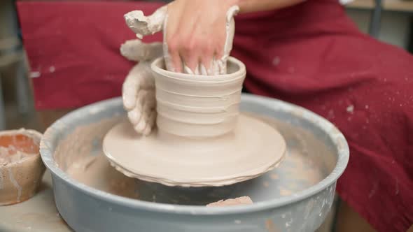 Handicraft the Potter Makes a Pitcher Out of Clay Closeup View of the Hands Production of Handmade