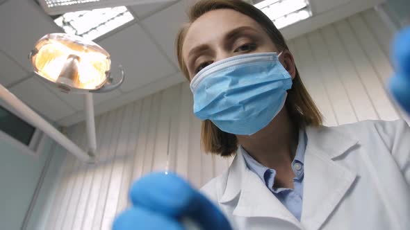 Dentist Examining Teeth