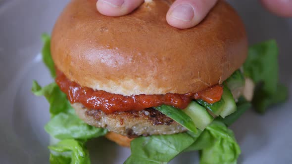 Delicious Vegan Burger with Tomato Souce. Fast Food.