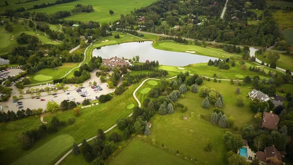 Beautiful aerial view across a large golf course surrounded by lush fields.