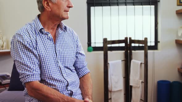 Senior man sitting in clinic 4k