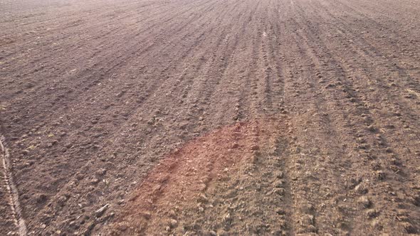 The Plowed Surface of an Agricultural Field Aerial View