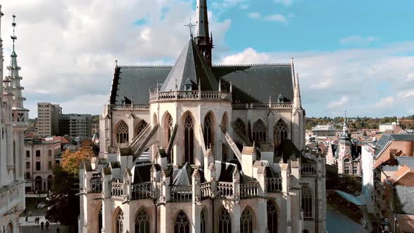 Saint Peter's Church, Leuven, Belgium. External Romanesque church facade. Aerial forward