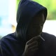 Hooded black male teenager secretly smoking, hiding from parents - VideoHive Item for Sale
