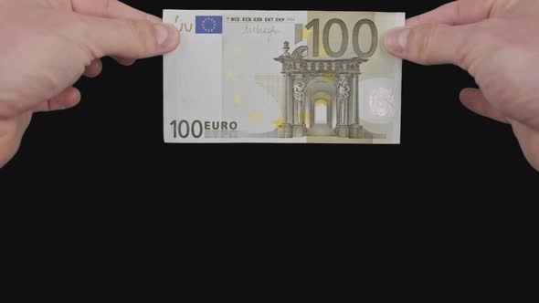 Male Hands Show a Banknote of 100 Euros From Top to Bottom with Alpha Channel