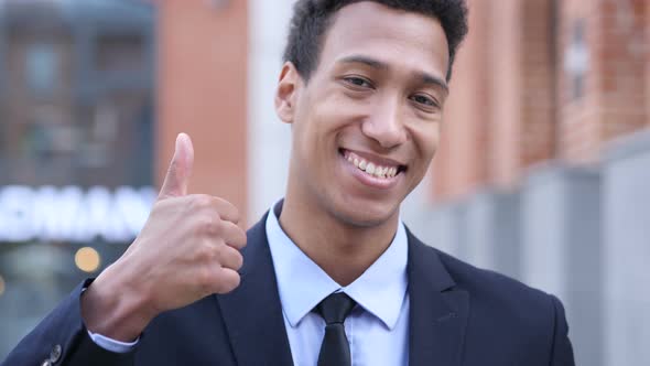 Thumbs Up by African Businessman