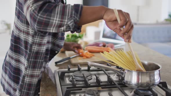 Senior man cooking in the kitchen